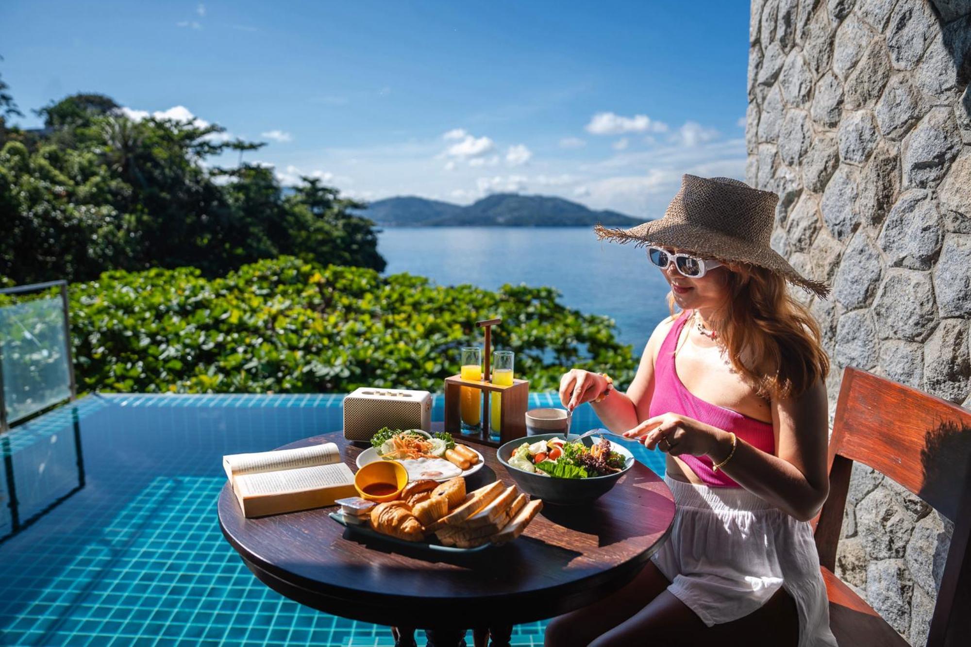 Zenmaya Oceanfront Phuket, Trademark Collection By Wyndham Patong Exterior photo A woman eating breakfast at a resort